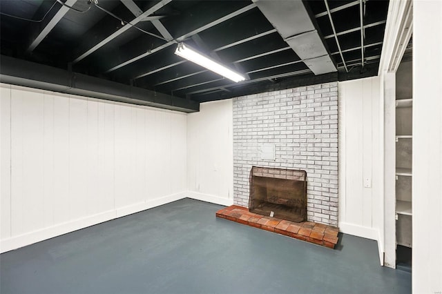 finished below grade area featuring a fireplace