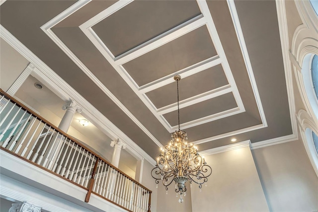 interior details featuring crown molding and an inviting chandelier