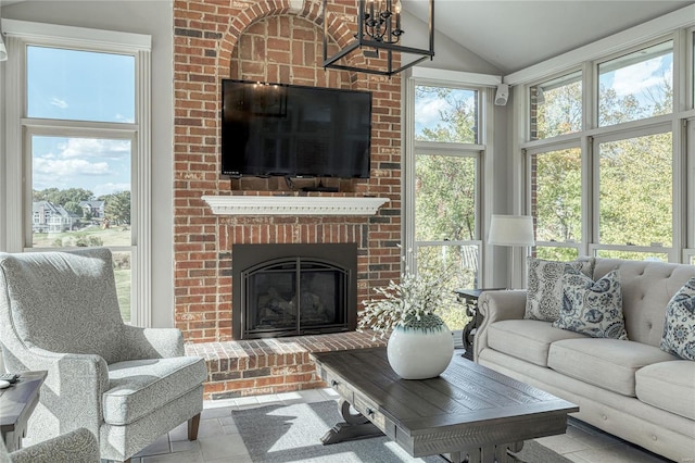 sunroom featuring vaulted ceiling
