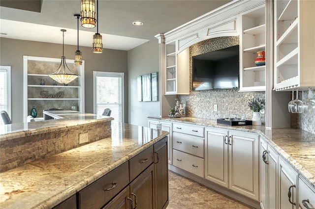 kitchen featuring open shelves, decorative light fixtures, and tasteful backsplash