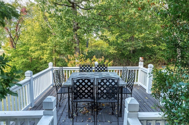 wooden terrace with outdoor dining area