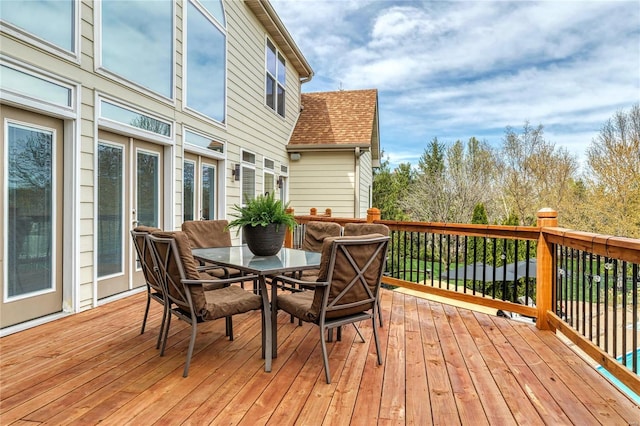deck featuring outdoor dining area