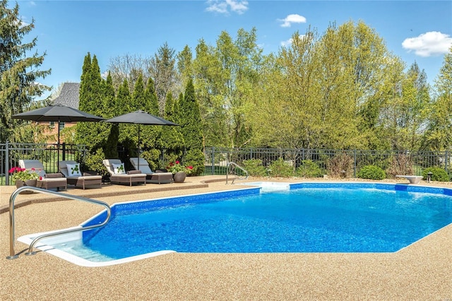 view of swimming pool with fence, a fenced in pool, and a patio area