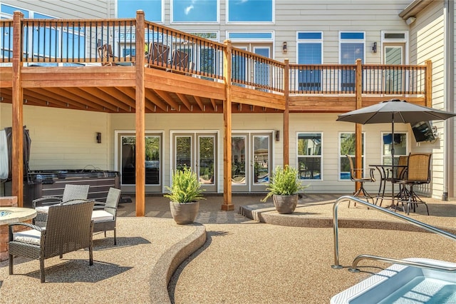 back of property with a patio and a wooden deck