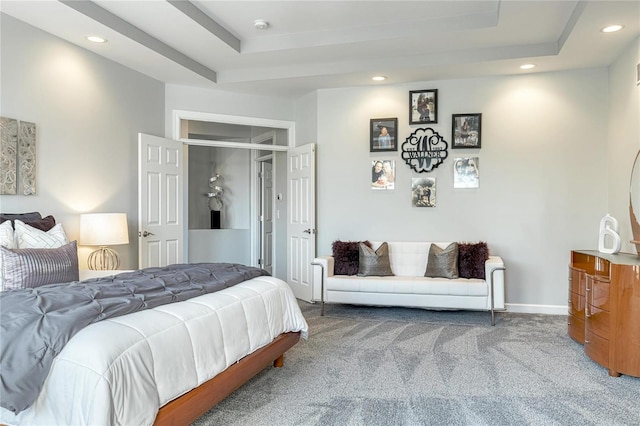 carpeted bedroom featuring baseboards, a tray ceiling, and recessed lighting