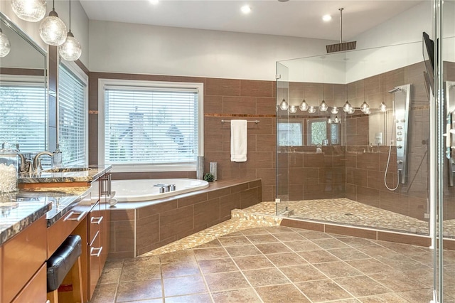 bathroom featuring vanity, visible vents, recessed lighting, a bath, and a shower stall