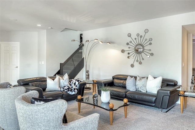 carpeted living room with stairway