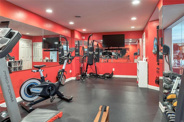 workout area with recessed lighting and baseboards