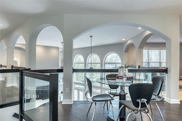 dining space with baseboards, recessed lighting, and wood finished floors