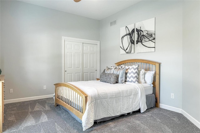 bedroom with baseboards, carpet, a closet, and visible vents