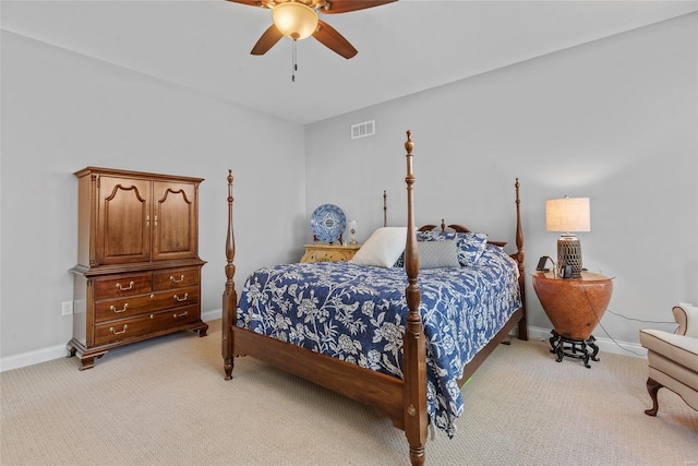 bedroom featuring light colored carpet, visible vents, ceiling fan, and baseboards
