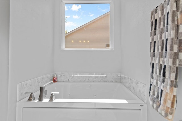 full bath with a jetted tub