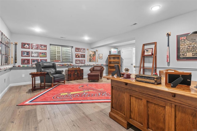 office space with baseboards, visible vents, light wood finished floors, and recessed lighting