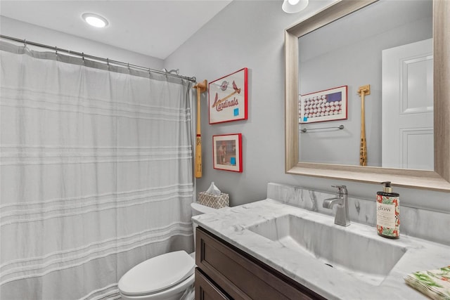 full bath featuring toilet and vanity