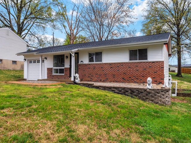 ranch-style home with a front lawn, brick siding, and a garage