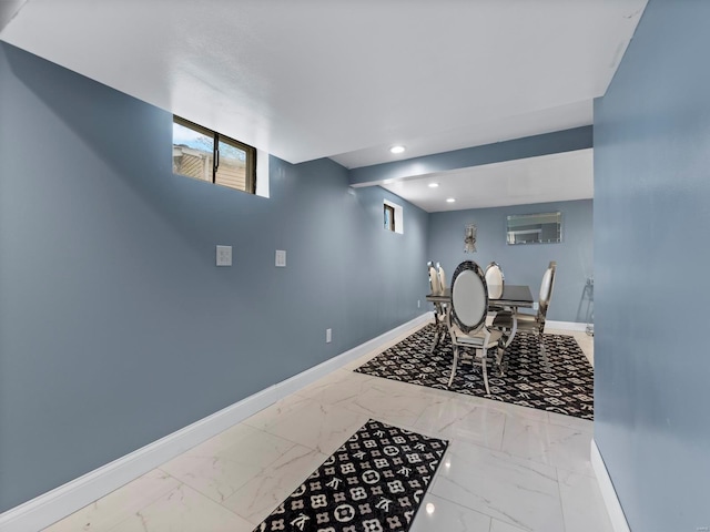 dining area with marble finish floor, baseboards, and recessed lighting