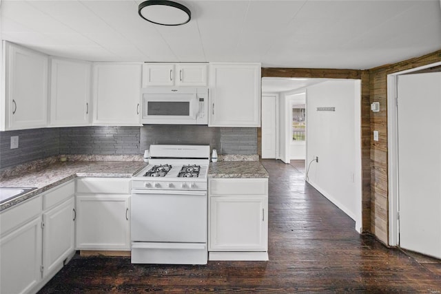 kitchen with white cabinetry, decorative backsplash, dark wood-style flooring, and white appliances