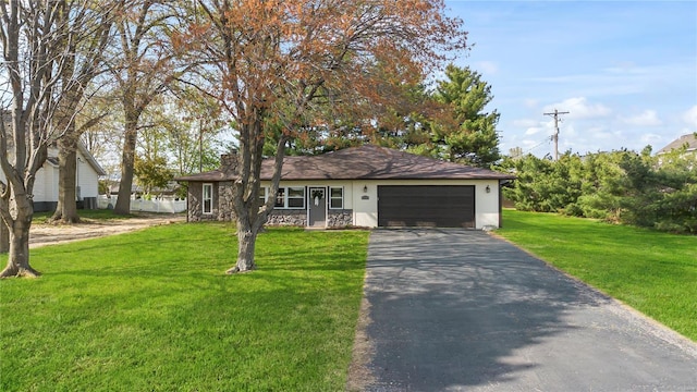 ranch-style house featuring driveway, stone siding, an attached garage, a front yard, and stucco siding