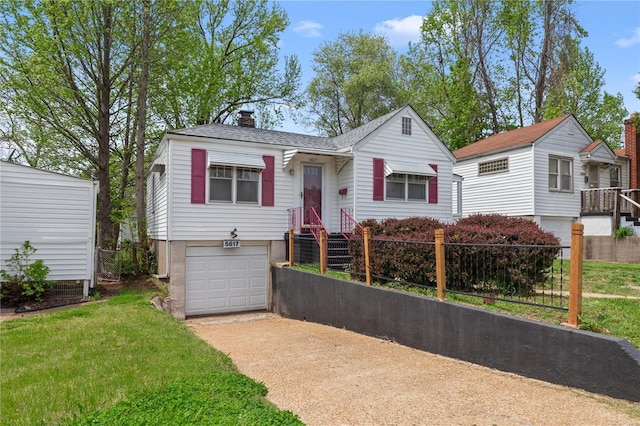 bungalow with concrete driveway, a chimney, a front yard, and a garage
