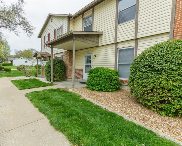 exterior space with brick siding