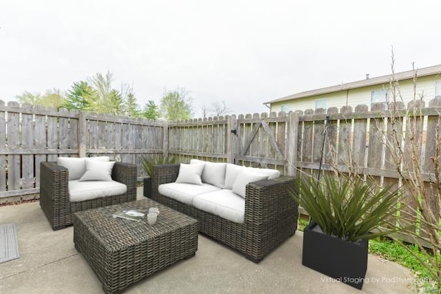 view of patio / terrace featuring an outdoor hangout area and a fenced backyard