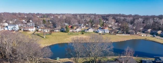 birds eye view of property with a water view and a residential view