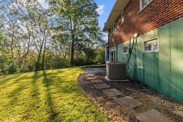 view of yard featuring central AC unit