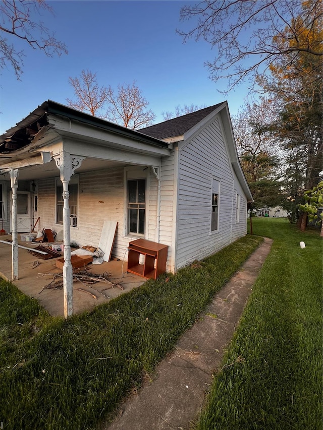 view of home's exterior featuring a yard and a patio