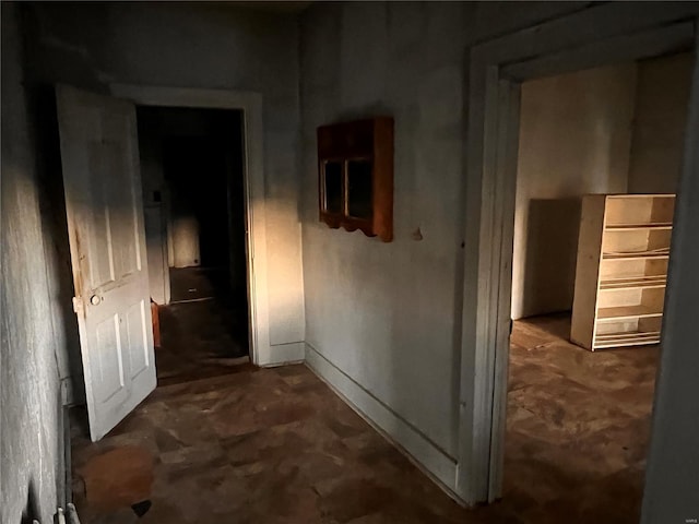 corridor featuring concrete flooring