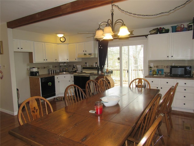 dining room with an inviting chandelier, baseboards, beam ceiling, and dark wood-style flooring