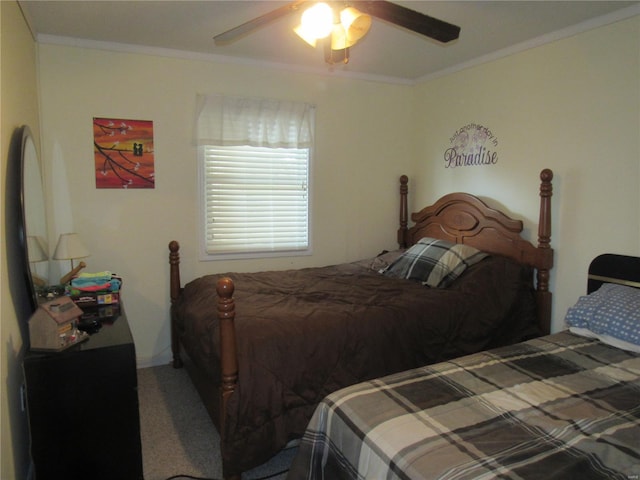 bedroom featuring ornamental molding, ceiling fan, and carpet