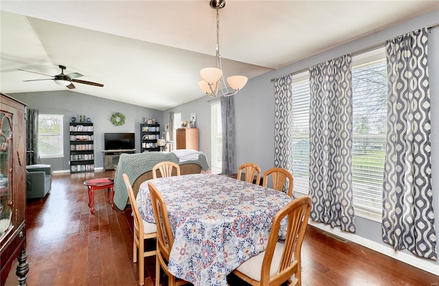 dining space with baseboards, vaulted ceiling, and dark wood-style floors