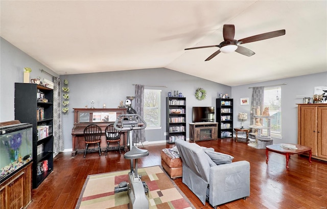 living room featuring lofted ceiling, wood finished floors, and ceiling fan