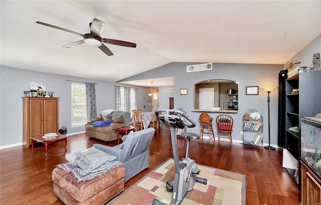 living room featuring ceiling fan, arched walkways, visible vents, wood finished floors, and lofted ceiling