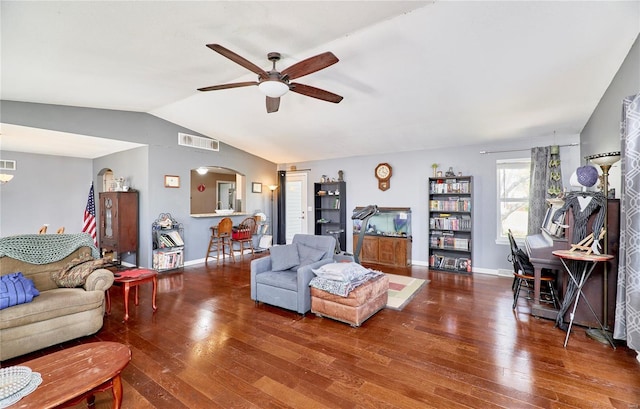 living area featuring hardwood / wood-style floors, ceiling fan, lofted ceiling, and visible vents