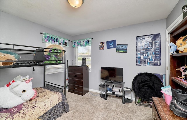 carpeted bedroom with baseboards