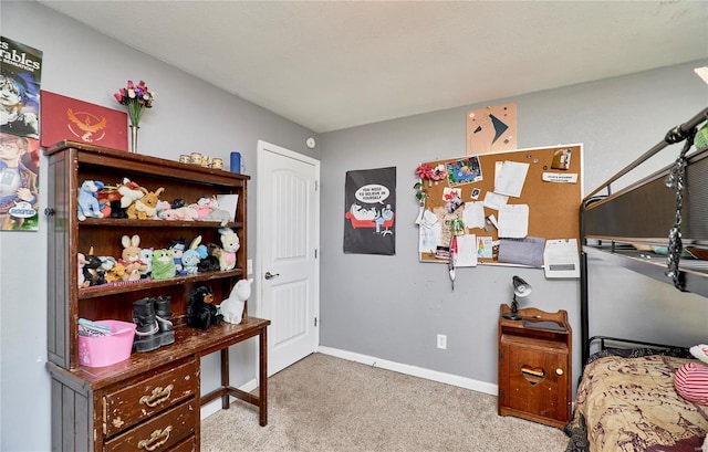 carpeted bedroom with baseboards