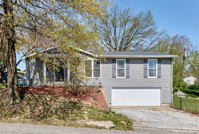 view of front of home featuring aphalt driveway and a garage