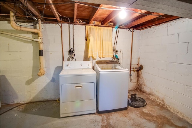 laundry area featuring washing machine and clothes dryer and laundry area