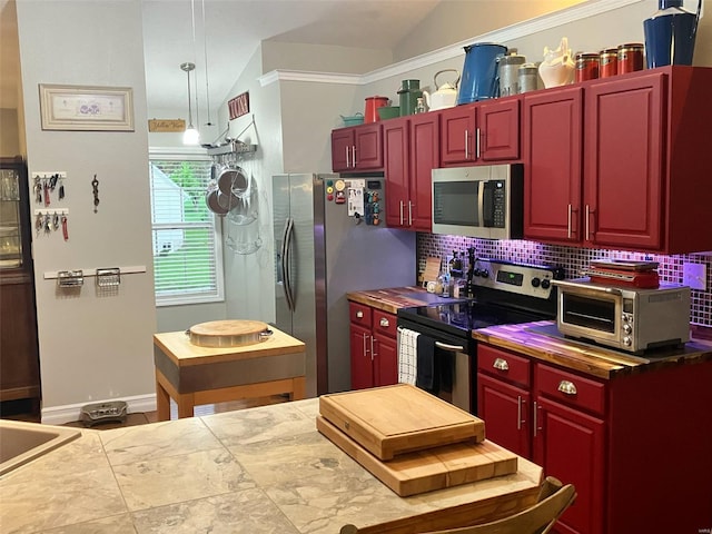 kitchen featuring stainless steel appliances, dark brown cabinets, decorative backsplash, and a toaster