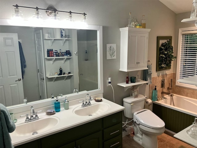 bathroom with toilet, tile patterned floors, a sink, and a bath