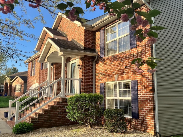 view of property exterior with brick siding