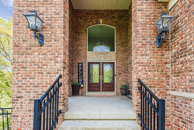 doorway to property with brick siding and french doors