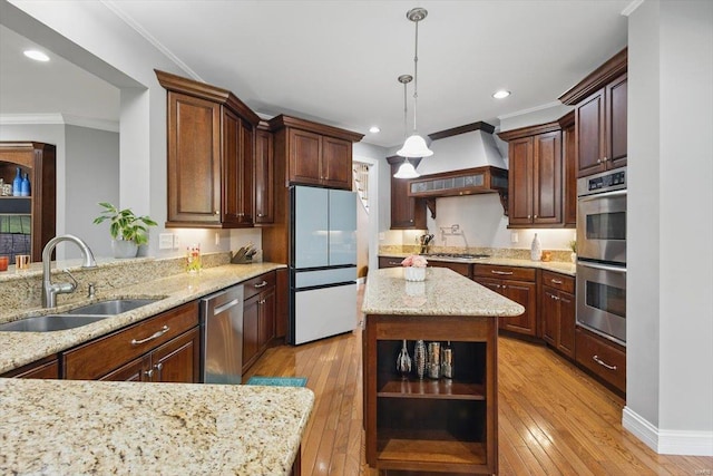 kitchen with open shelves, appliances with stainless steel finishes, a sink, light wood-style floors, and custom exhaust hood