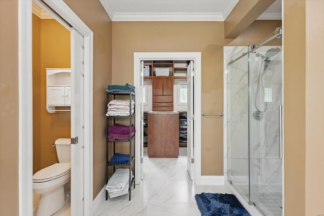 bathroom featuring a shower stall, baseboards, toilet, marble finish floor, and ornamental molding