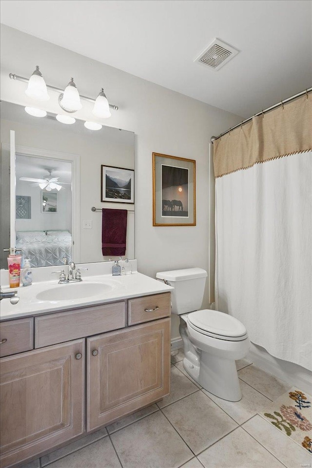 full bath featuring connected bathroom, vanity, toilet, tile patterned floors, and visible vents