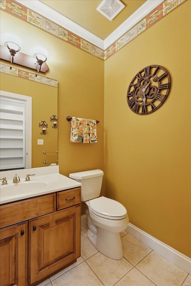 half bath with vanity, toilet, tile patterned floors, baseboards, and visible vents