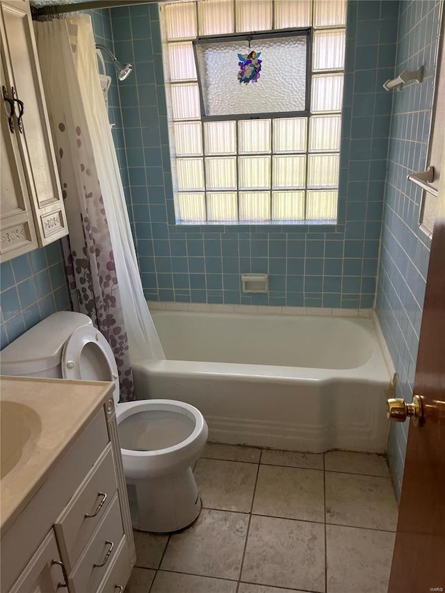 full bath with vanity, toilet, shower / tub combo with curtain, and tile patterned floors