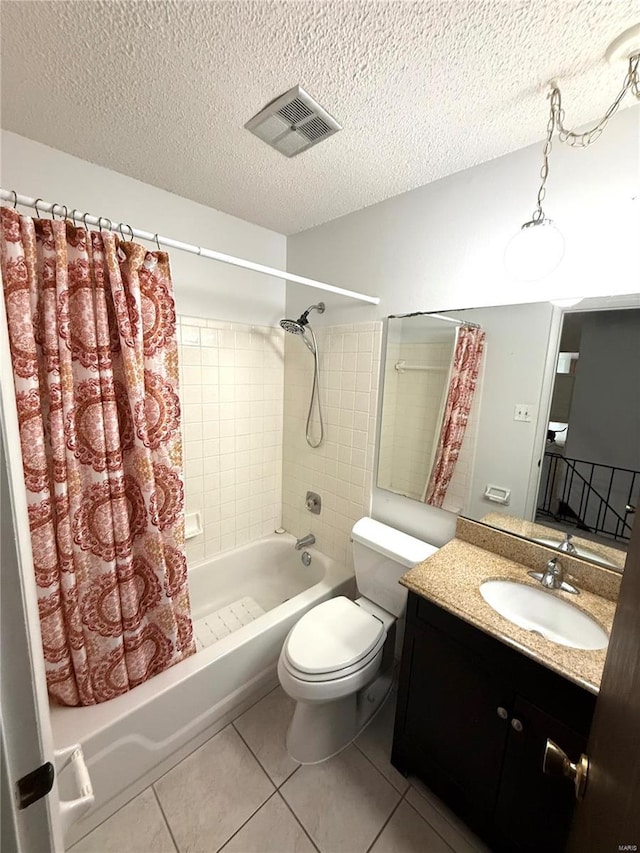 bathroom featuring a textured ceiling, visible vents, tile patterned floors, and shower / bath combo with shower curtain