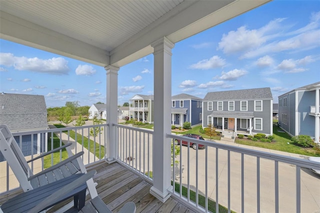 wooden deck with a residential view